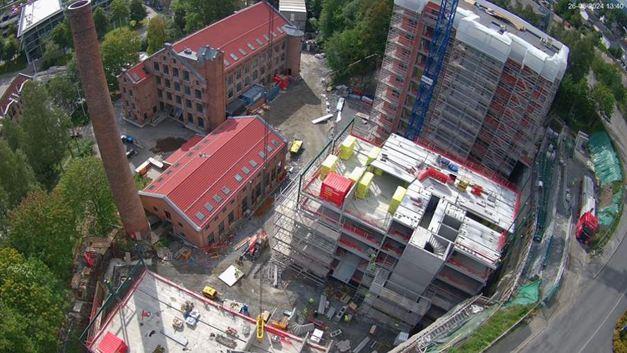 Illustrasjonsbilde av Gjerdrumsvei D, E og F, nye studentboliger i Nydalen studentby. Brune, høye blokker.